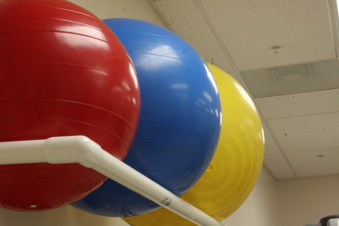 Therapeutic balls are helpful when it comes to working out core muscles. A person can use them by leaning on them and performing crunches or bouncing with a straight spine and tight abdominals.