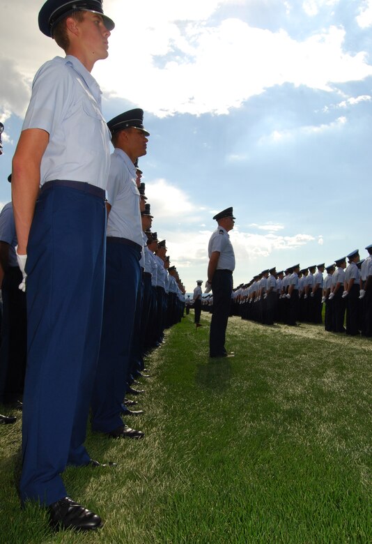 Fourth-class cadets stand at parade rest during the Air Force Academy's Acceptance Day ceremony at the Stillman Parade Field Aug. 4, 2010. The ceremony marks the cadets' completion of Basic Cadet Training and transition into the Academy's Cadet Wing. (U.S. Air Force photo/Staff Sgt. Don Branum)