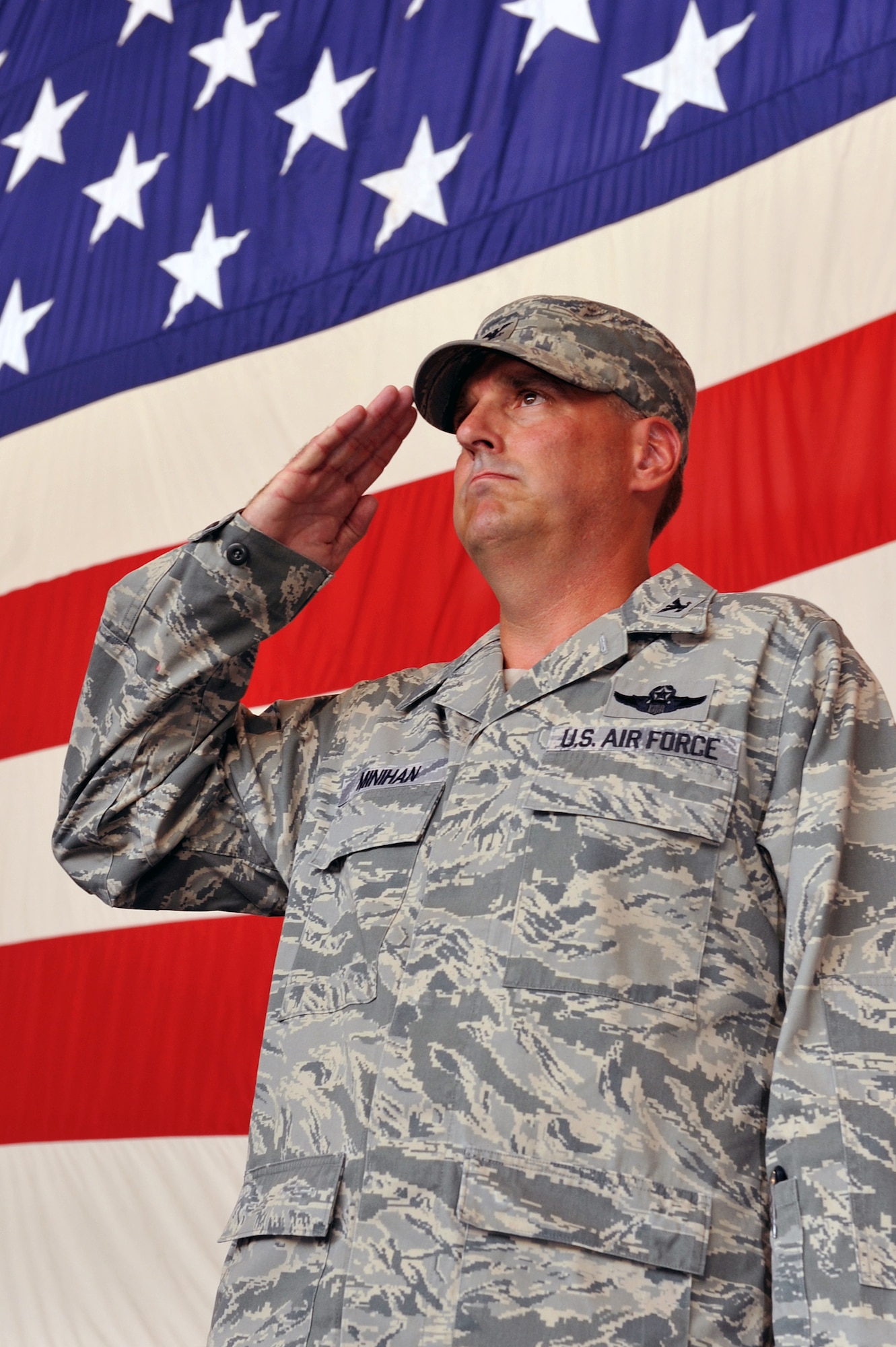 Col. Michael Minihan, 19th Airlift Wing commander, gives his first salute to the 19th AW during a change of command ceremony here Aug. 2.  The 19th AW is the host unit to the largest C-130 base in the world.  (U.S. Air Force photo by Staff Sgt. Chris Willis)