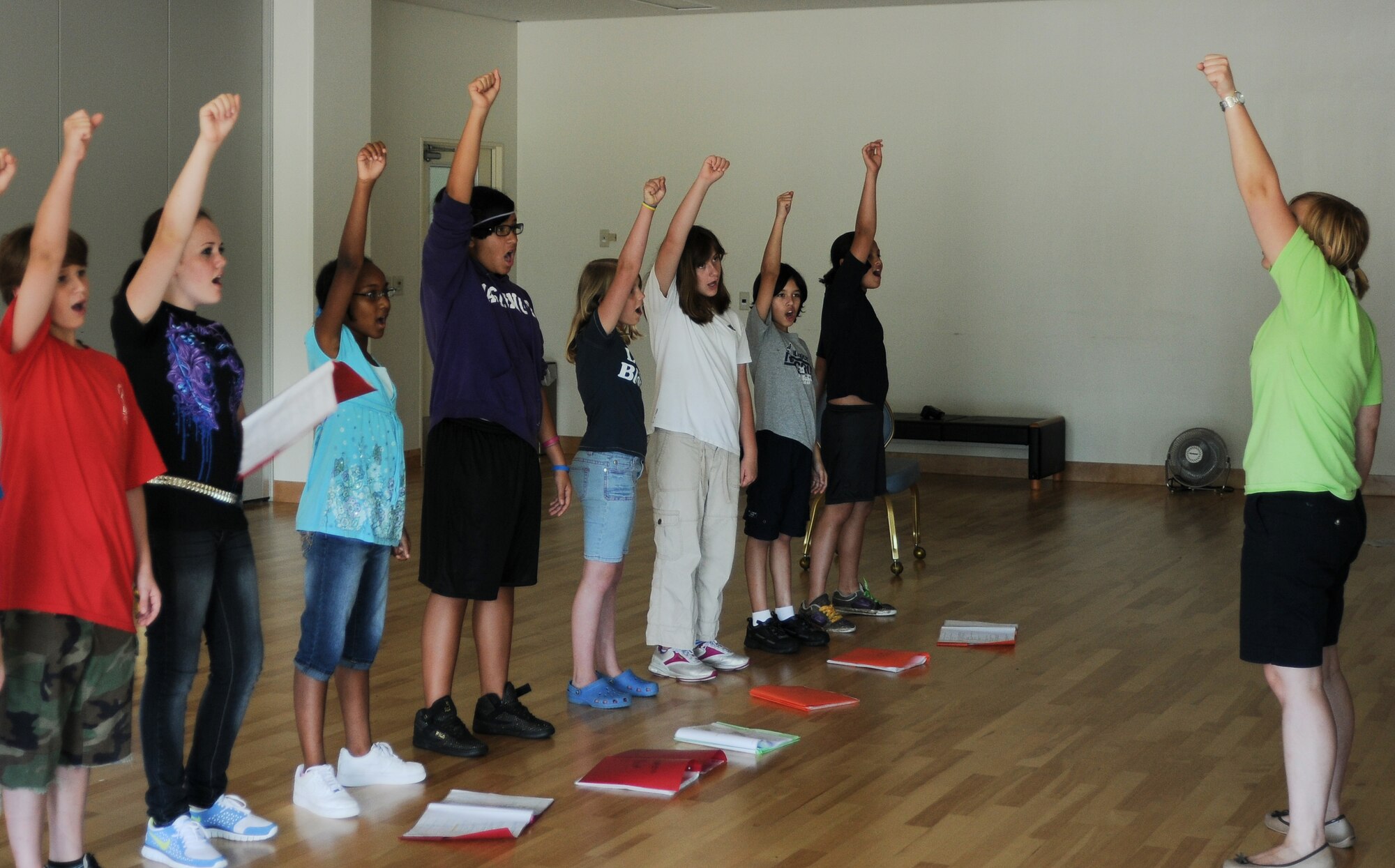 YOKOTA AIR BASE, Japan -- Emma Fyffe, Instructor with Missoula Children's Theatre, practices one of the dance moves for the final song in the production of "The Frog Prince", the move is meant as a way for the children to remember that they are hitting a higher note. Showtime for "The Frog Prince" is scheduled for 6 August, 1800 at the Taiyo Community Center. (U.S. Air Force Photo/ Airman 1st Class Katrina R. Menchaca) 