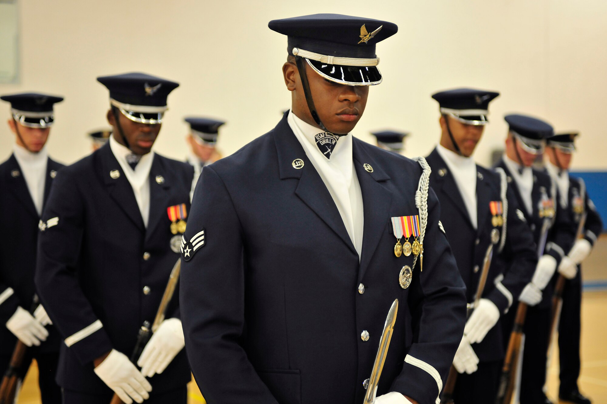 United States Air Force Honor Guard Drill Team members, begin a performance at Cannon Air Force Base, N.M. Aug 4, 2010. The team visited to Cannon to entertain and recruit. About 80-85 percent of their manning comes from Basic Military Training and the rest from active duty Airmen. (U.S. Air Force photo by Tech Sgt. Josef Cole)(RELEASED)