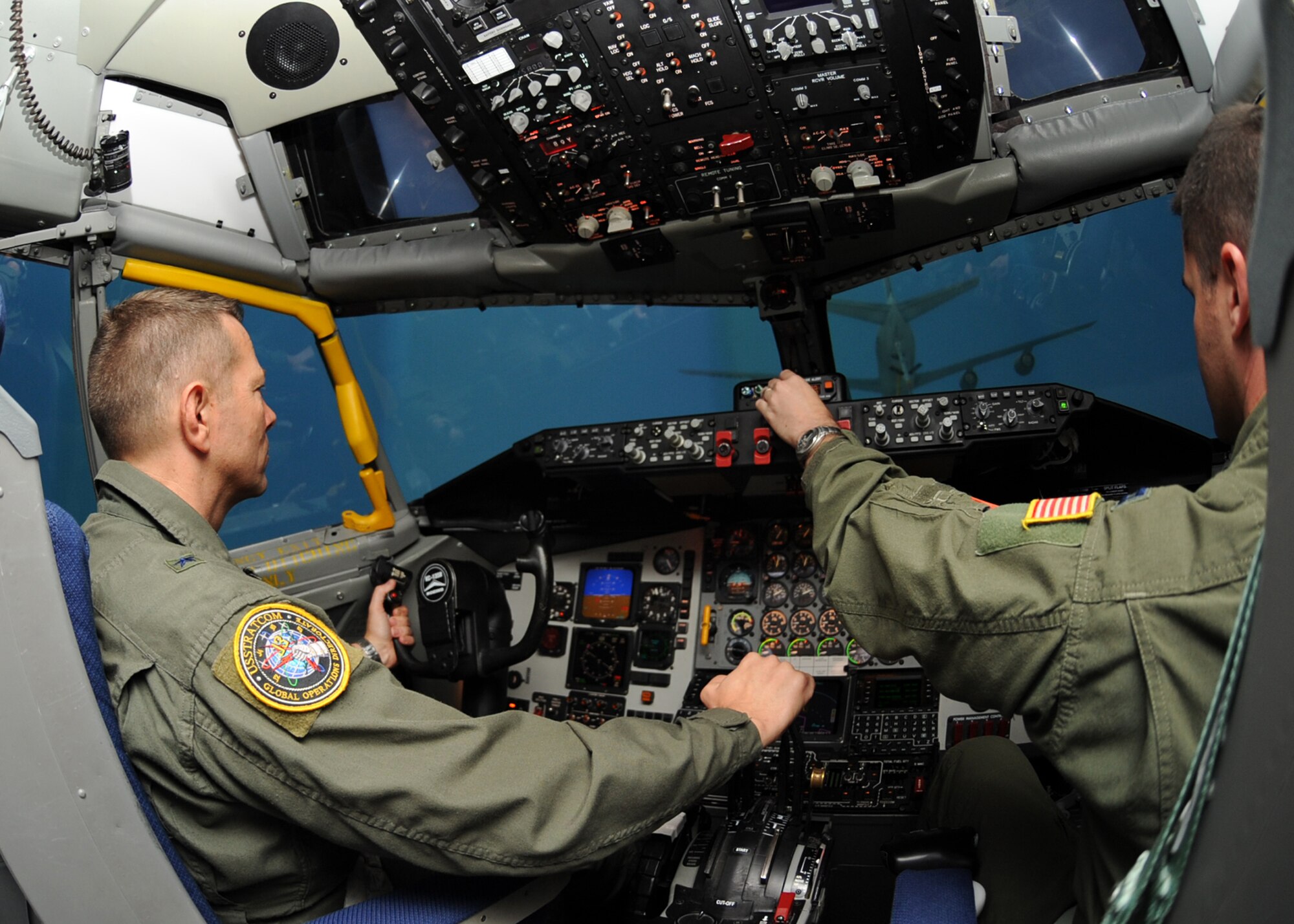Brig. Gen. Joseph Brown IV, U.S. Strategic Command Nuclear Operations deputy director, “flies” a KC-135 Stratotanker simulator alongside Capt. Greg Auerbach, 349th Air Refueling Squadron receiver air refueling instructor pilot, July 29, 2010, McConnell Air Force Base, Kan.  General Brown visited McConnell as part of a U.S. Strategic Command road show to inform bases on their roles in the U.S. Strategic Command overall mission.  The U.S. Strategic Command is responsible for detering attacks on vital U.S. interests, ensuring freedom of action in space and cyberspace, while synchronizing global missile defense plans and operations to provide integrated surveillance and reconnaissance allocation recommendations to the Secretary of Defense.  (U.S. Air Force photo/Senior Airman Maria Ruiz)