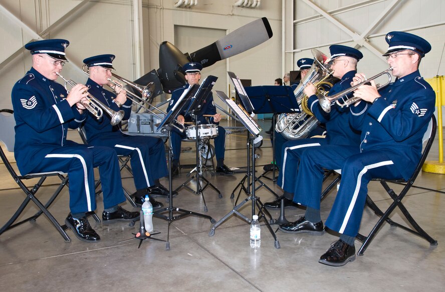 Members of the U.S. Air Force Band perform music prior to the 19th Airlift Wing change of command ceremony Aug. 2 at Little Rock AFB, Ark. Col. Michael Minihan, a former 61st Airlift Squadron pilot, took command of the 19th AW Black Knights. (U.S. Air Force photo by Staff Sgt. Nestor Cruz) 
