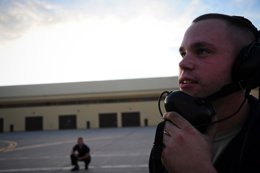 ELLSWORTH AIR FORCE BASE S.D. – Airman 1st Class Joseph Dowdell, 28th Aircraft Maintenance Squadron crew chief, uses a ground support radio during a preflight check on a B-1B Lancer, Aug. 3. Airman Dowdell uses the ground support radio to communicate with other crew chiefs working on the B-1 during the check. (U.S. Air Force photo/Airman 1st Class Corey Hook)