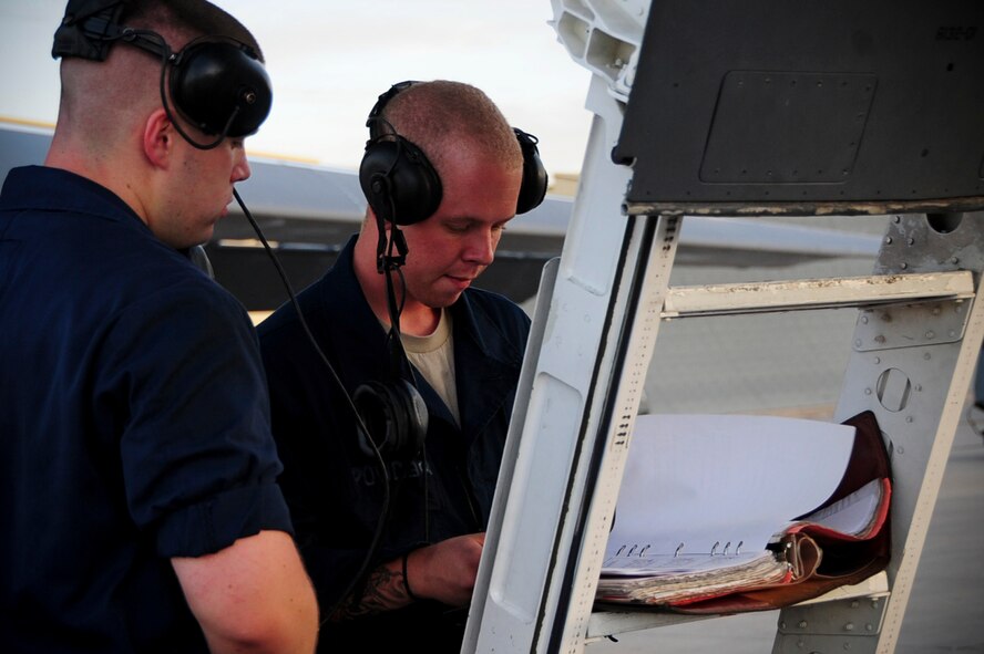 ELLSWORTH AIR FORCE BASE S.D. – (Left) Airmen 1st Class Joseph Dowdell and Kelly Richardson review a B-1B Lancer preflight checklist, Aug. 3. Both Airmen are assigned to the 28th Aircraft Maintenance Squadron as crew chiefs. (U.S. Air Force photo/Airman 1st Class Corey Hook)