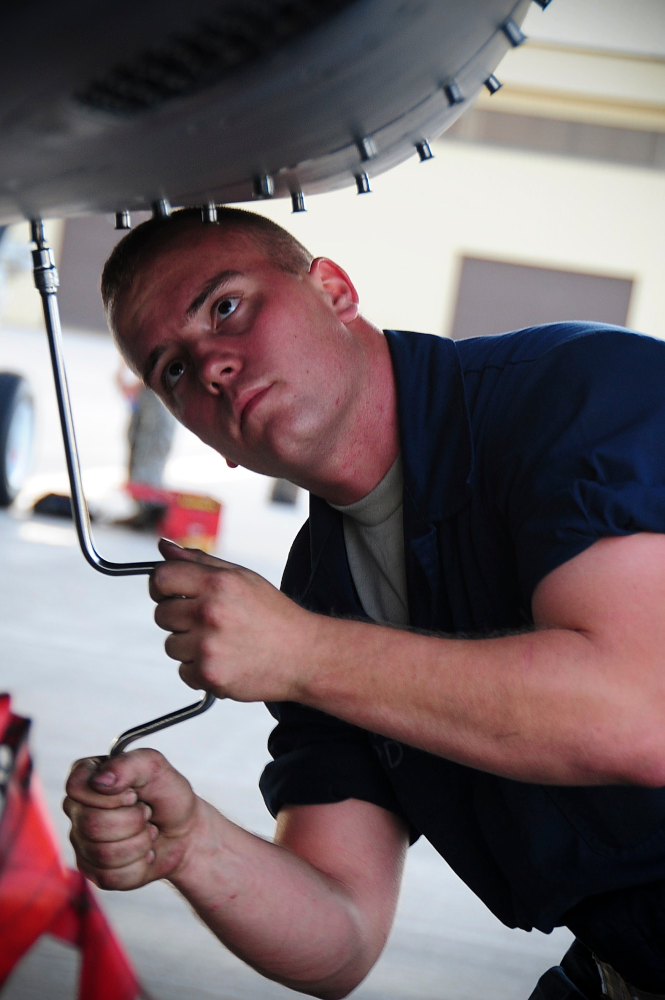 ELLSWORTH AIR FORCE BASE S.D. – Airman 1st Class Joshua Radford, 28th Aircraft Maintenance Squadron crew chief, opens a panel on a B-1B Lancer, Aug. 3. After opening the panel, crew chiefs check hydraulic and nitrogen levels of the B-1 to ensure mission effectiveness. (U.S. Air Force photo/Airman 1st Class Corey Hook)
