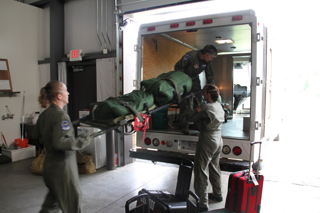932nd Aeromedical Evacuation Squadran members load up a truck with all their medical gear during a training scenario at the Air Force Reserve unit.  (Photo/Maj. Stan Paregien)