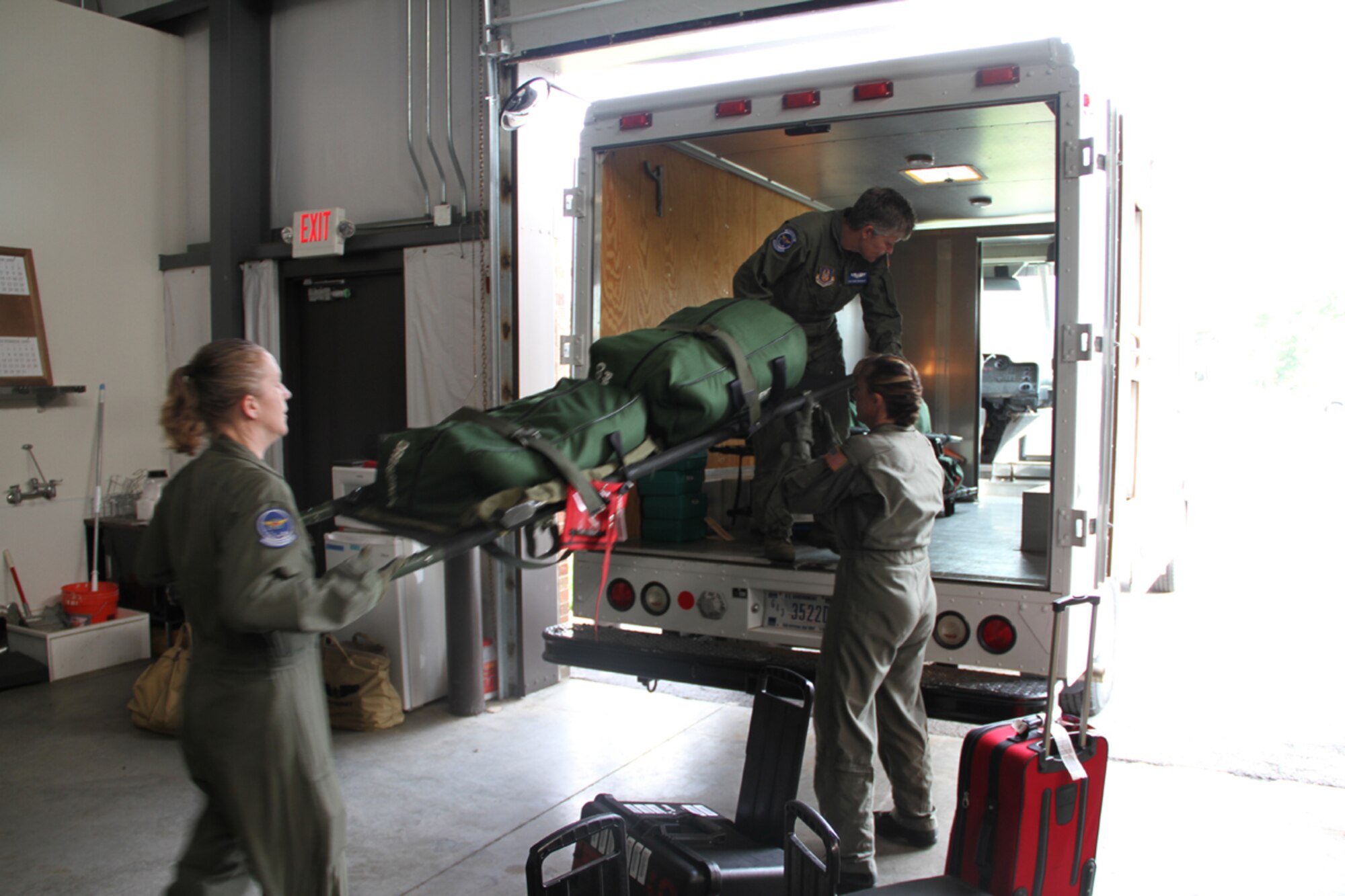 932nd Aeromedical Evacuation Squadran members load up a truck with all their medical gear during a training scenario at the Air Force Reserve unit.  (Photo/Maj. Stan Paregien)