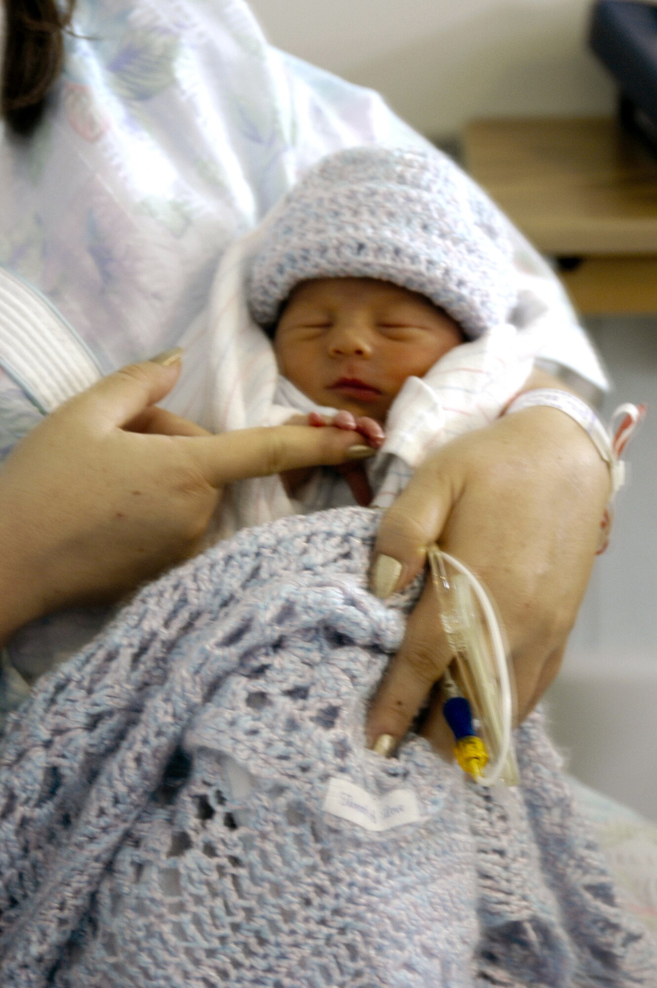 A mother holds her baby at Wilford Hall Medical Center at Lackland Air Force Base, Texas, which has been named a "Baby-Friendly Hospital" through the Texas Department of State Health Services' Texas Ten Step Facility Program. (U.S. Air Force photo)