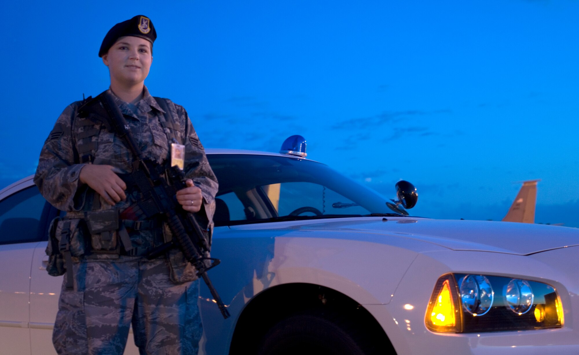 Senior Airman Ashley Rodriguez, 22nd Security Forces Squadron installation patrolman, guards an entry control point to the flightline Aug. 2, 2010, McConnell Air Force Base, Kan. The Winthrop, Maine, native performs police and security duties at McConnell which includes patrolling the base, conducting identification checks at the gates and ensuring the safety of Team McConnell. (U.S. Air Force photo/Airman 1st Class Armando A. Schwier-Morales)