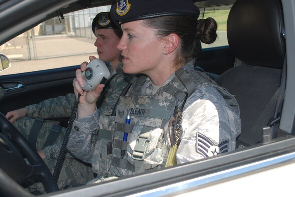 Staff Sgt. Elizabeth Sleath, 341st Security Forces Squadron patrolman, takea a radio call while on patrol July 28. (U.S. Air Force photo/Airman 1st Class Kristina Overton)