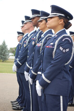 Members of the Malmstrom Base Honor Guard stand at ease while waiting for a uniform inspection at the Quarterly Honor Guard All-Call July 23. The all call includes awards presentations, hales and farewells, and flight competitions to determine the best flight of the quarter. The uniform inspection was one of the criteria to determine the best flight. (U.S. Air Force photo/Airman 1st Class Kristina Overton)
