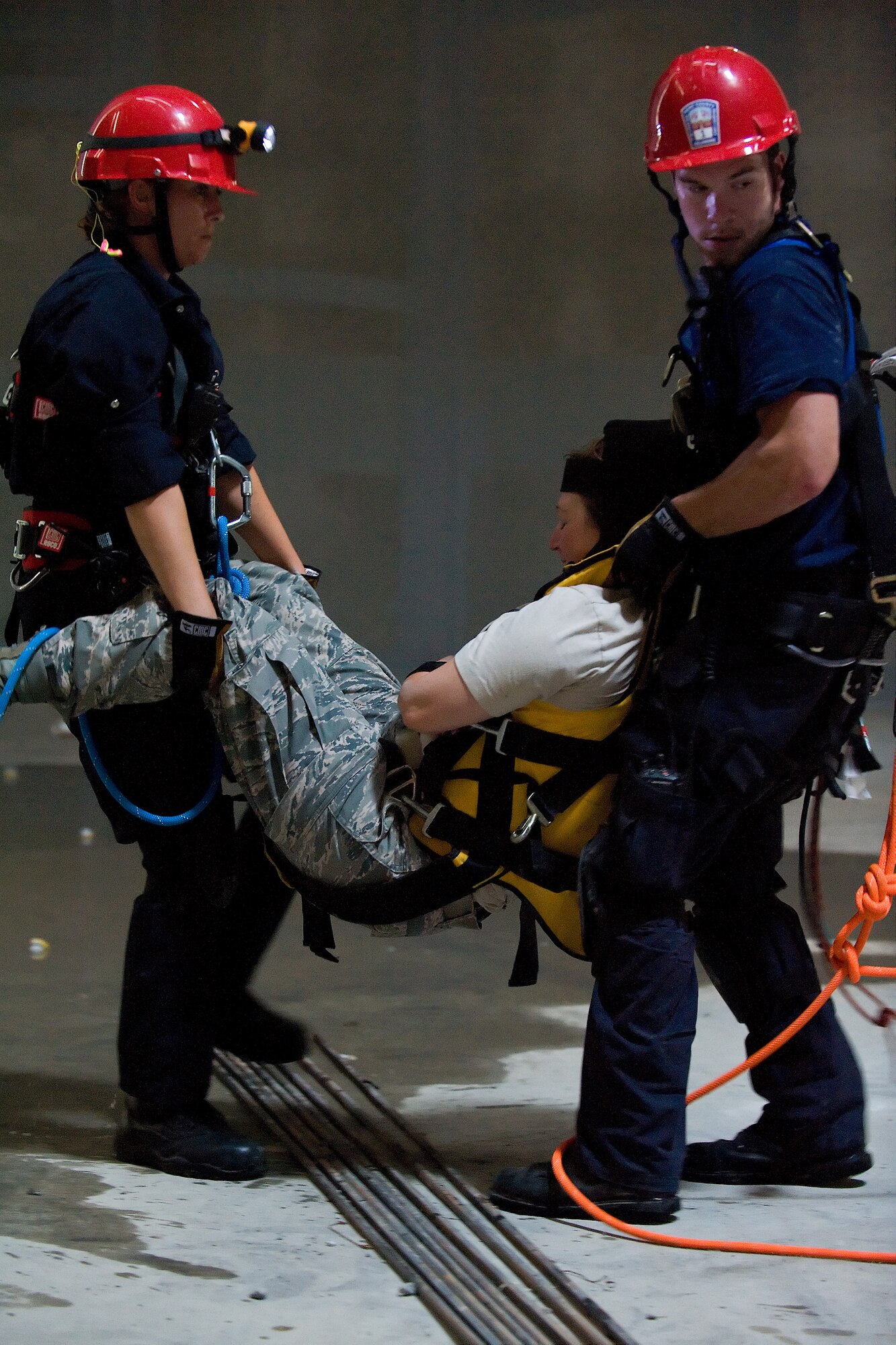 Two members of the Kent County Special Operations team carry a "victim" inside the new one million gallon water tank on Dover Air Force Base, Del., July 24, 2010. The 436th Civil Engineer Squadron Fire Department hosted a "confined space rescue" training and exercise at the CE compound. (U.S. Air Force photo by Roland Balik/Released)
