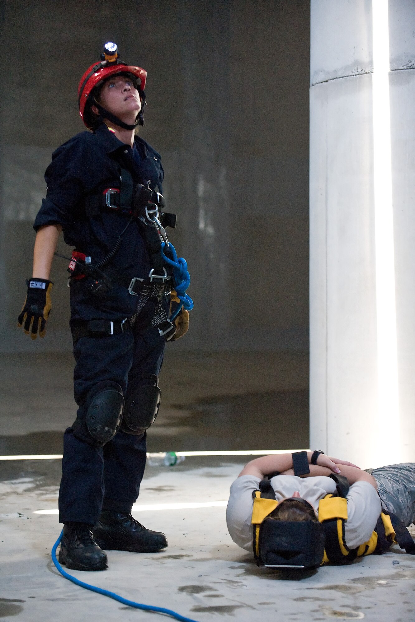 A Kent County Special Operations team member awaits for a rescue line to be secured before attempting to rescue a "victim" inside the new one million gallon water tank on Dover Air Force Base, Del., July 24, 2010. The 436th Civil Engineer Squadron Fire Department hosted a "confined space rescue" training and exercise at the CE compound. (U.S. Air Force photo by Roland Balik/Released)