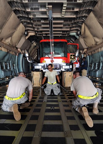 Airmen from the 437th Aerial Port Squadron secure water drilling equipment traveling down range to support the U.S. forces in the Middle East July 30, 2010, on Joint Base Charleston, S.C. The well drilling system is the third of such shipments to be airlifted via Joint Base Charleston, providing troops with on-site sources of water in the arid climate of the Middle East. (U.S. Air Force photo/Senior Airman Timothy Taylor)