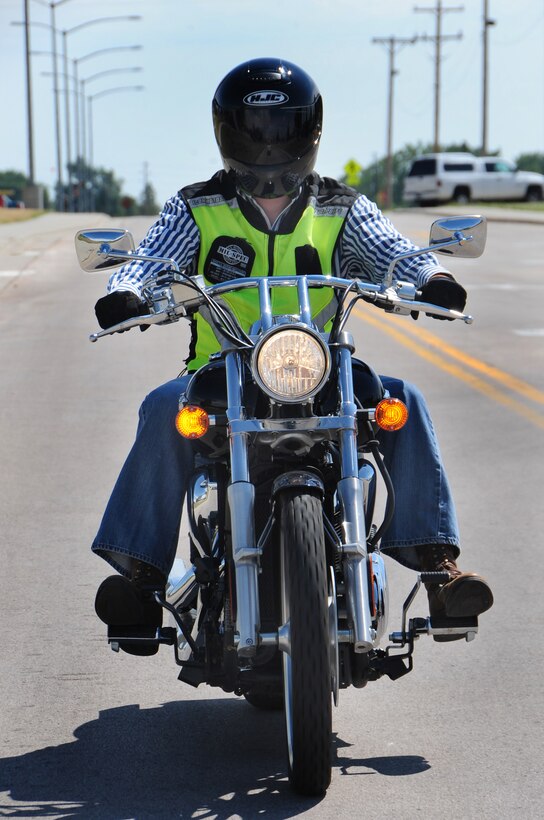 ELLSWORTH AIR FORCE BASE, S.D. -- Airman 1st Class James Mason, 28th Civil Engineer Squadron heating, ventilation and air-conditioning technician, rides his motorcycle around base, Aug. 3.  It is important to wear all the proper protective gear while riding, such as a helmet, gloves and boots. (U.S. Air Force photo/Airman 1st Class Anthony Sanchelli)