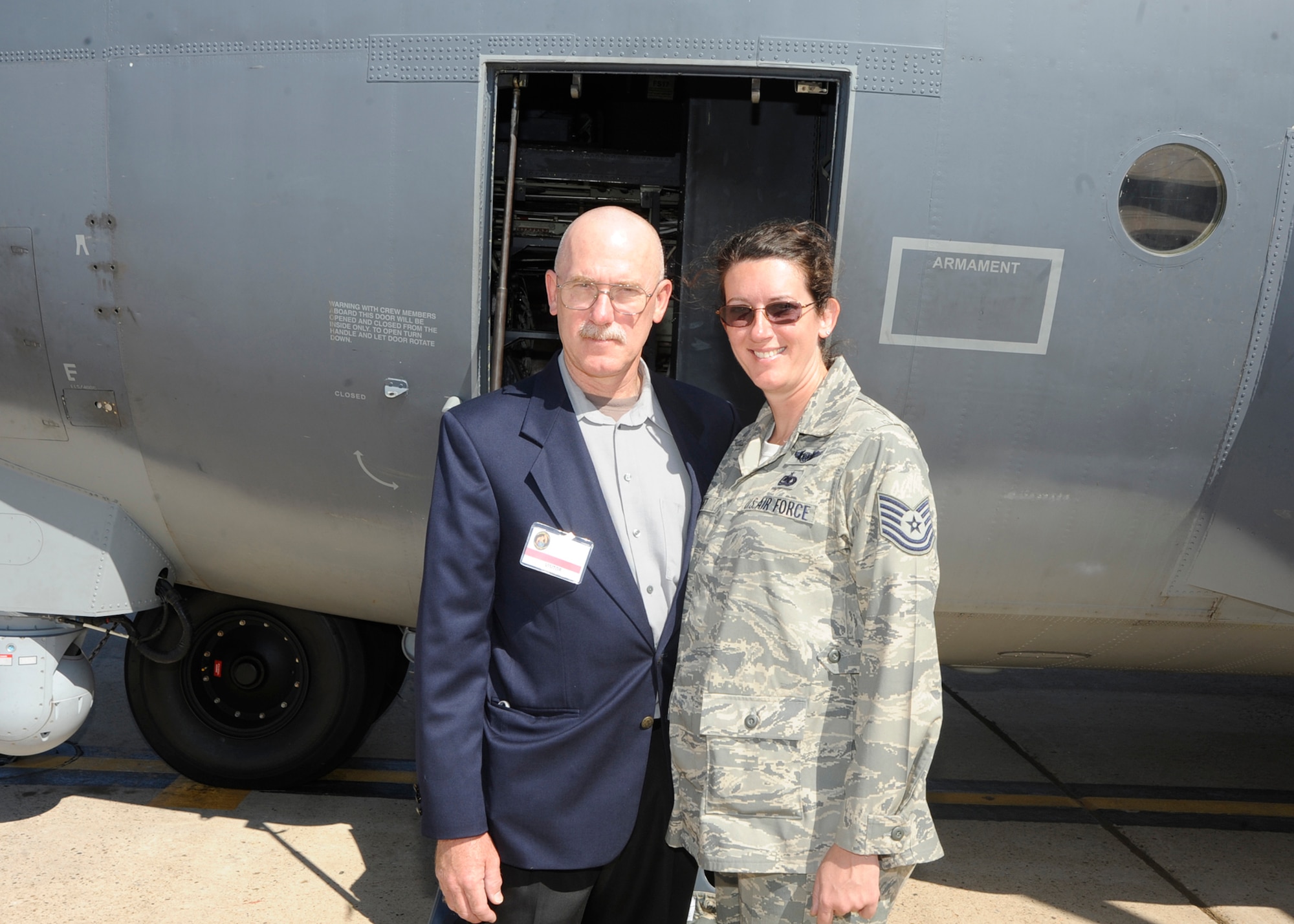 Recently promoted Master Sergeant Jennifer Seibt, 73rd Special Operations Squadron, and her father, retired Coast Guard Chief Warrant Officer 3 William Seibt, stand in front of an MC-130W Dragon Spear July 30 at Cannon Air Force Base, N.M. Mr. Seibt is a former avionics and navigator for C-130 aircraft, while Sergeant Seibt has been a loadmaster for the venerable airframe for seven years. (U.S. Air Force photo by Greg Allen) 