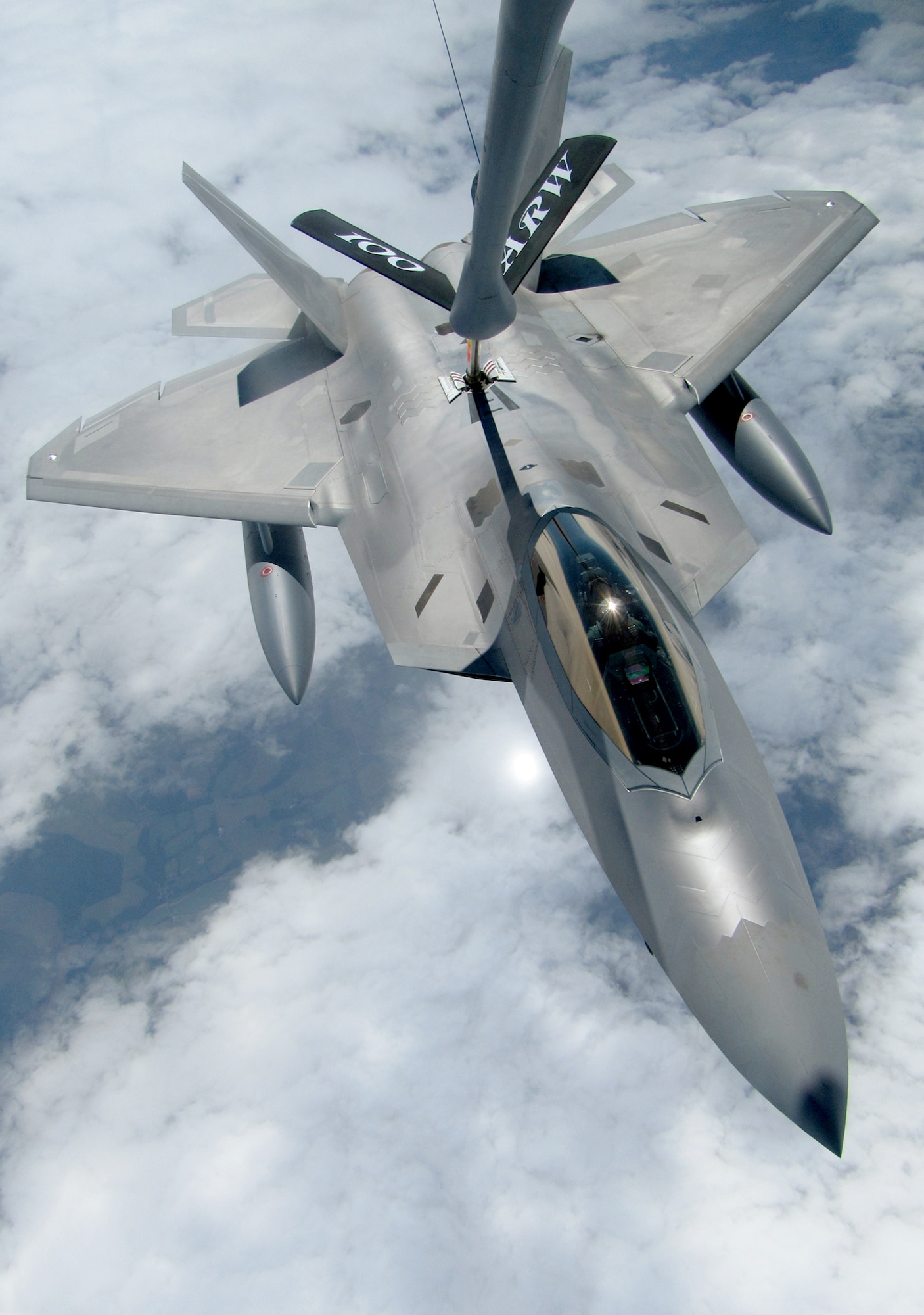 An F-22 Raptor from Elmendorf Air Force Base, Alaska, takes gas from a KC-135 Stratotanker July 27, 2010. By flying with a tanker, the fighter could routinely fill its fuel tanks to ensure it had enough fuel to reach a safe base in the event it had to land. The tanker is assigned to the 100th Air Refueling Wing at Royal Air Force Mildenhall, England. (U.S. Air Force photo/Staff Sgt. Austin M. May)