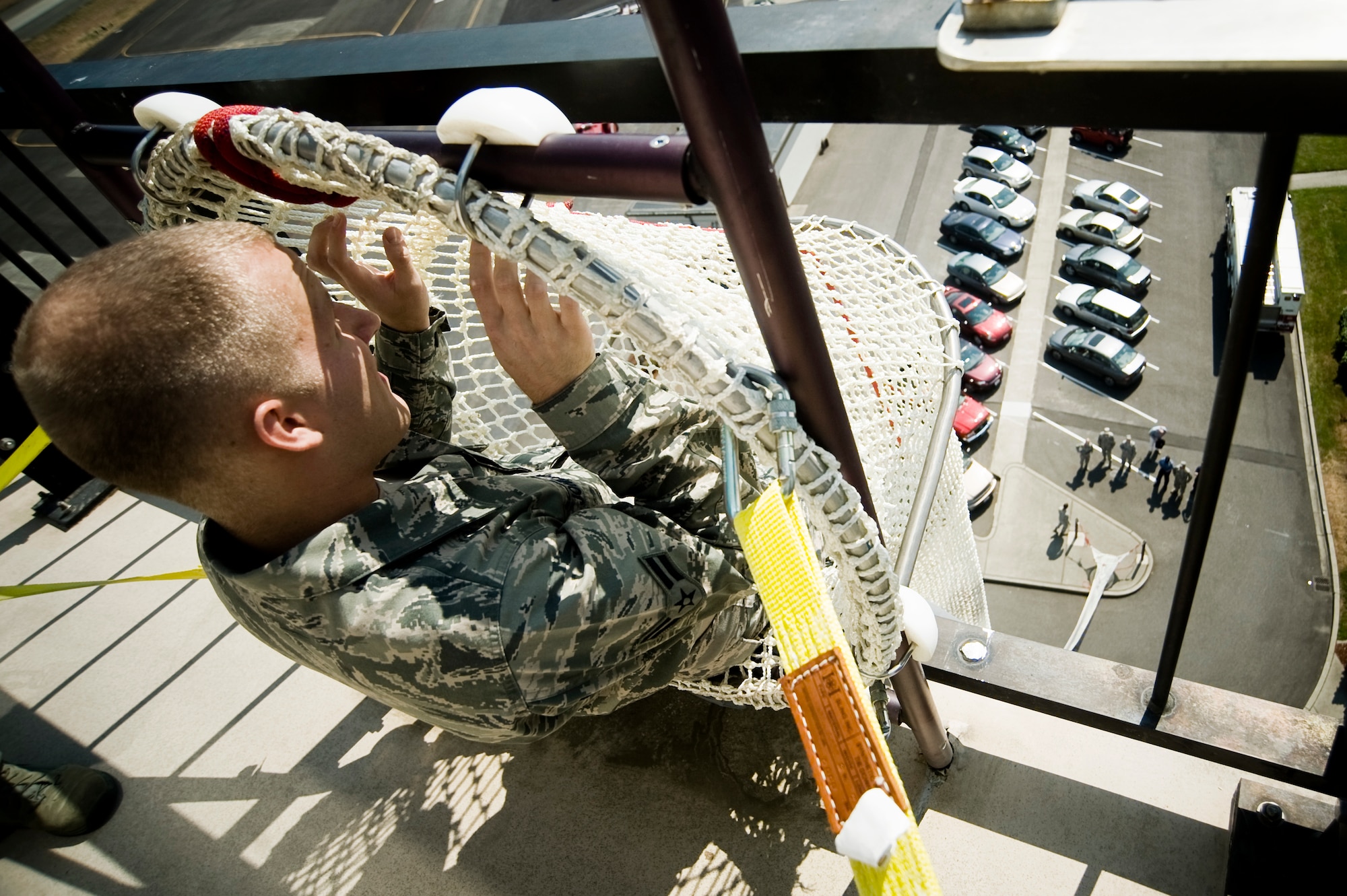 Airman 1st Class Ryan Johnson, an air traffic controller assigned to the 62nd Operations Support Squadron, prepares to evacuate from the McChord Field tower during an emergency training exercise here Aug. 3. (U.S. Air Force Photo/Abner Guzman)