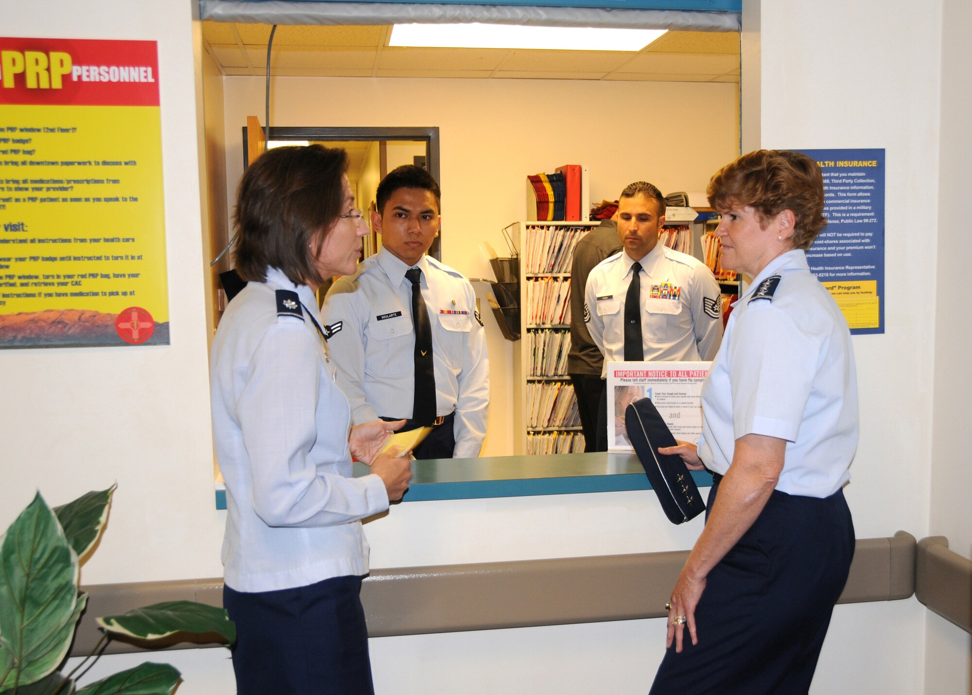 During her visit to Kirtland Air Force Base, Lt. Gen. Janet
Wolfenbarger, Air Force Materiel Command vice commander, listens to a
briefing by Lt. Col. Lidia Ilcus, 377th Medical Operations Squadron
commander, about the status of the Personnel Readiness Program, with Airman
1st Class Victor Goularte (center left) and Tech. Sgt. Jacob Tarin standing
by. (U.S. Air Force photo/Dennis Carlson)