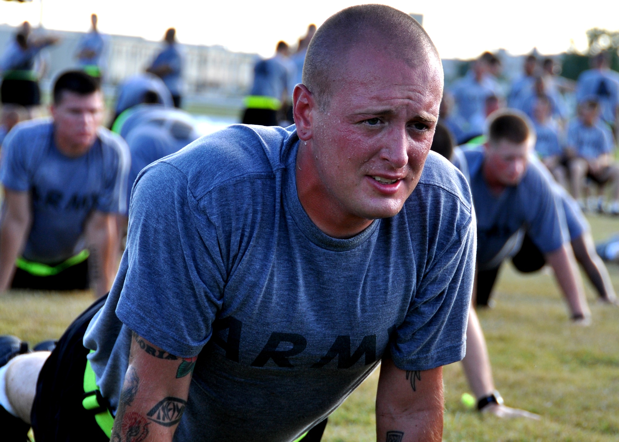 A Soldier holds in the push-up position during an afternoon physical training session at Eglin Air Force Base, Fla.  The 450 members of Bravo Company exercise four days a week after EOD classes end.  Combined with Alpha Company, there are approximately 750 Soldiers in stages of training at the 35-week Navy EOD course located at Eglin.  (U.S. Air Force photo/Tech Sgt. Cheryl Foster.)