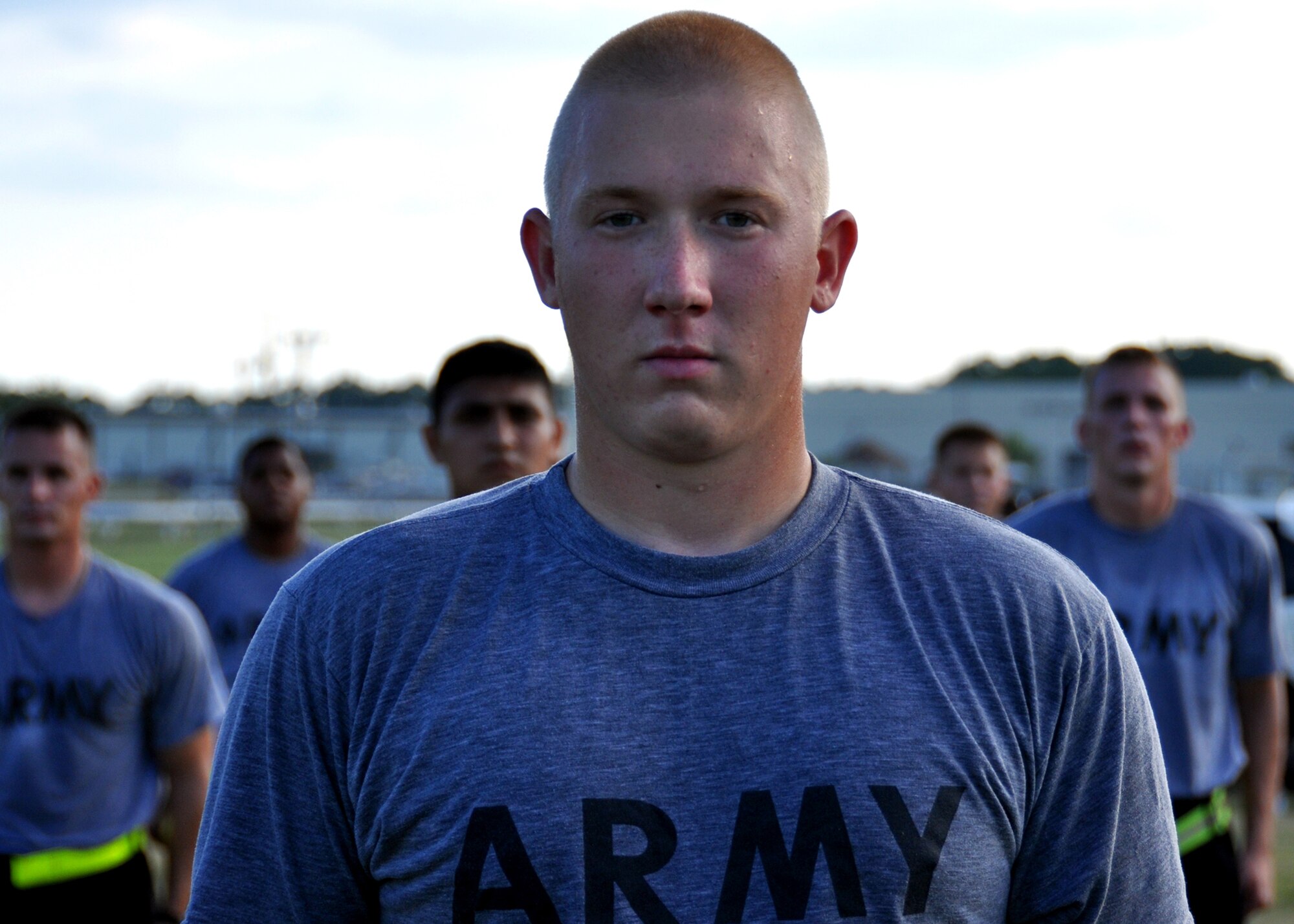 Pvt. Dusty Hall and other members of his team wait to begin the next exercise during an afternoon physical training session at Eglin Air Force Base, Fla.  The 450 members of Bravo Company exercise four days a week after EOD classes end.  Combined with Alpha Company, there are approximately 750 Soldiers in stages of training at the 35-week Navy EOD course located at Eglin.  (U.S. Air Force photo/Tech Sgt. Cheryl Foster.)