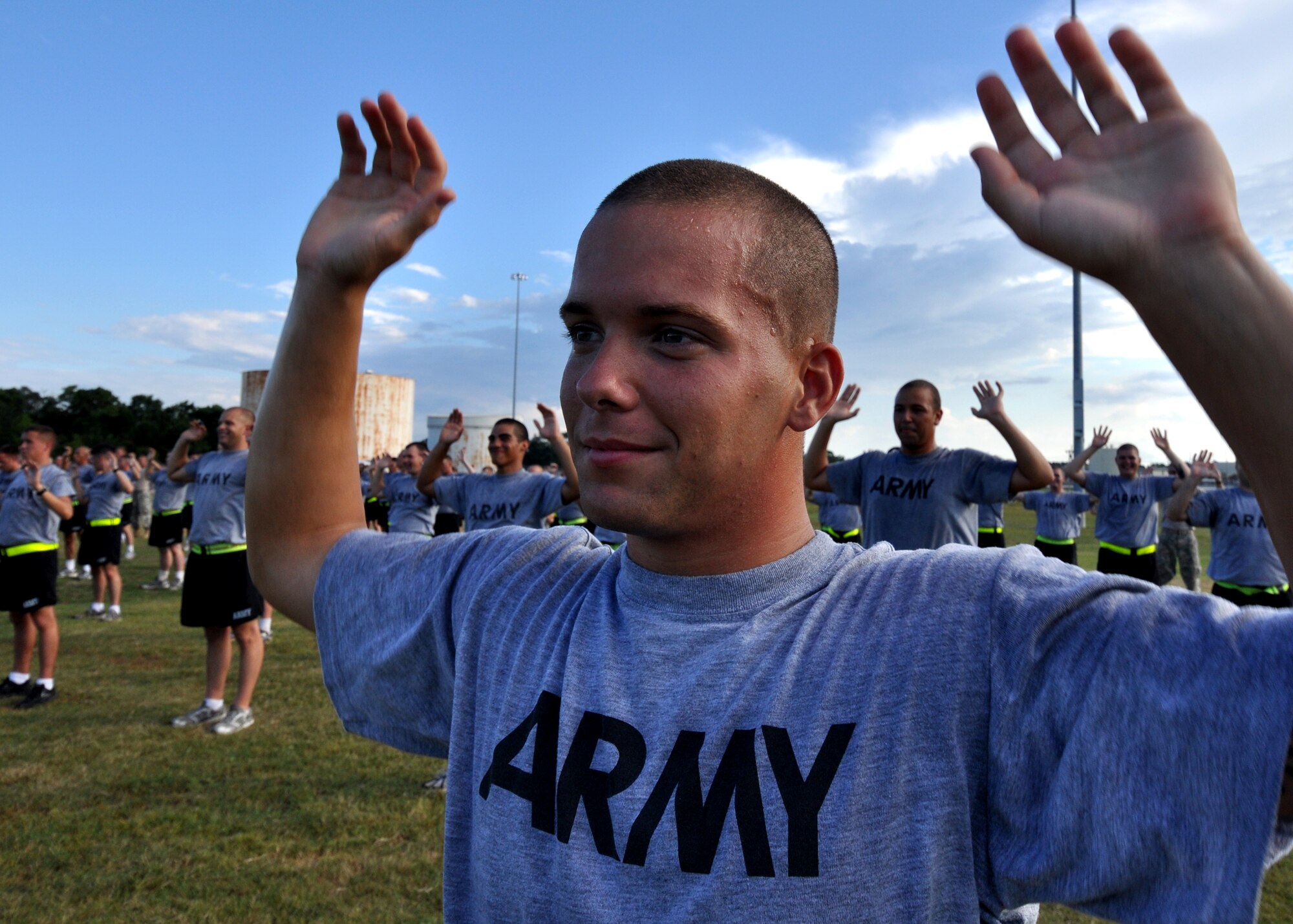 Pfc. Joshua Ogle keeps his arms up in a strength exercise during an afternoon physical training session at Eglin Air Force Base, Fla.  The 450 members of Bravo Company exercise four days a week after EOD classes end.  Combined with Alpha Company, there are approximately 750 Soldiers in stages of training at the 35-week Navy EOD course located at Eglin.  (U.S. Air Force photo/Tech Sgt. Cheryl Foster.) 