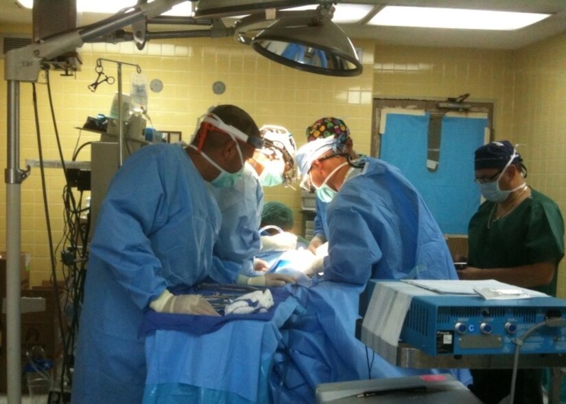 TEGUCIGALPA, Honduras -- Surgeons perform an operation on a Honduran patient July 19 in Hospital Escuela here, as part of a humanitarian civic assistance urology surgical campaign conducted by a team of U.S. military and Honduran medical personnel July 18-30. During the two-week Medical Readiness Training Exercise (MEDRETE), the team of surgeons and support staff provided high-quality, specialized care to 185 Hondurans in need. (Courtesy photo.)