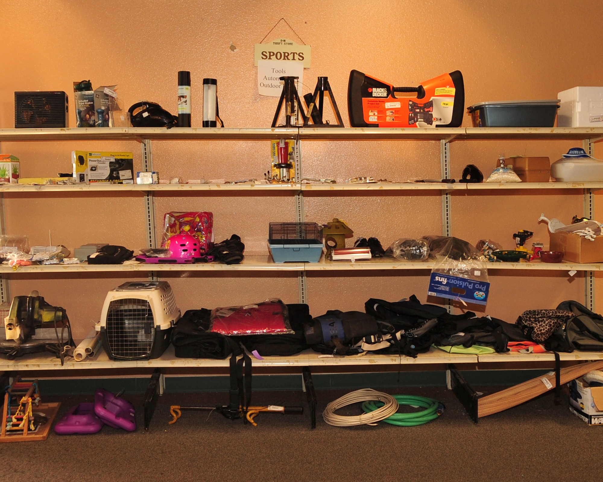 From tools and trampolines to vinyl albums and vintage apparel, the D-M
Thrift Shop displayed its wares Aug. 3, 2010, during its annual August
reopening. The shop is open from 9 a.m to 2 p.m. on Tuesdays and Wednesdays
and again from 9 a.m. to noon on the first Saturday of each month from
August 2010 to June 2011 -- but donations are accepted 24/7 in their new
indoor drop-off area. (U.S. Air Force photo/Airman 1st Class Jerilyn
Quintanilla)

