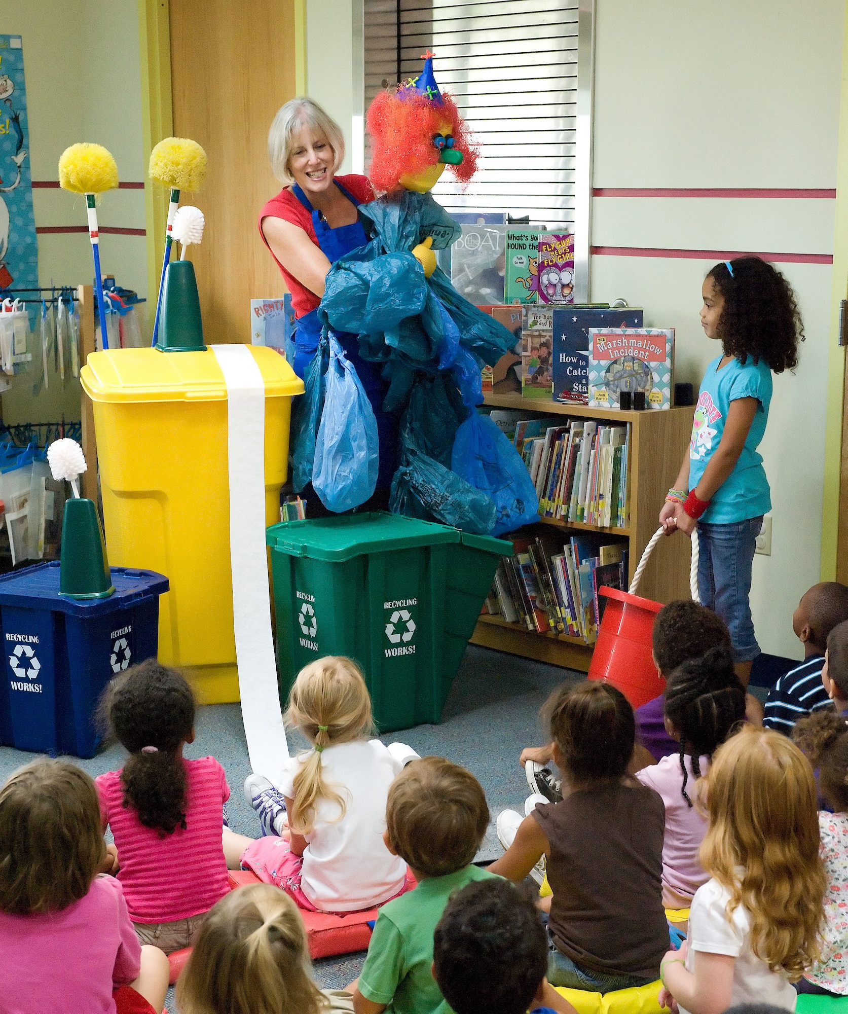 Kathleen Jacobs, puppeteer and storyteller, performed the ?Magic Pots and Recycled Bottles? program for Team Dover children at the Base Library on Dover Air Force Base, Del., Aug. 3, 2010. The program was offered as part of this year?s Summer Library Reading Program with the theme, ?Make a Splash ? READ.? (U.S. Air Force photo by Jason Minto/Released)