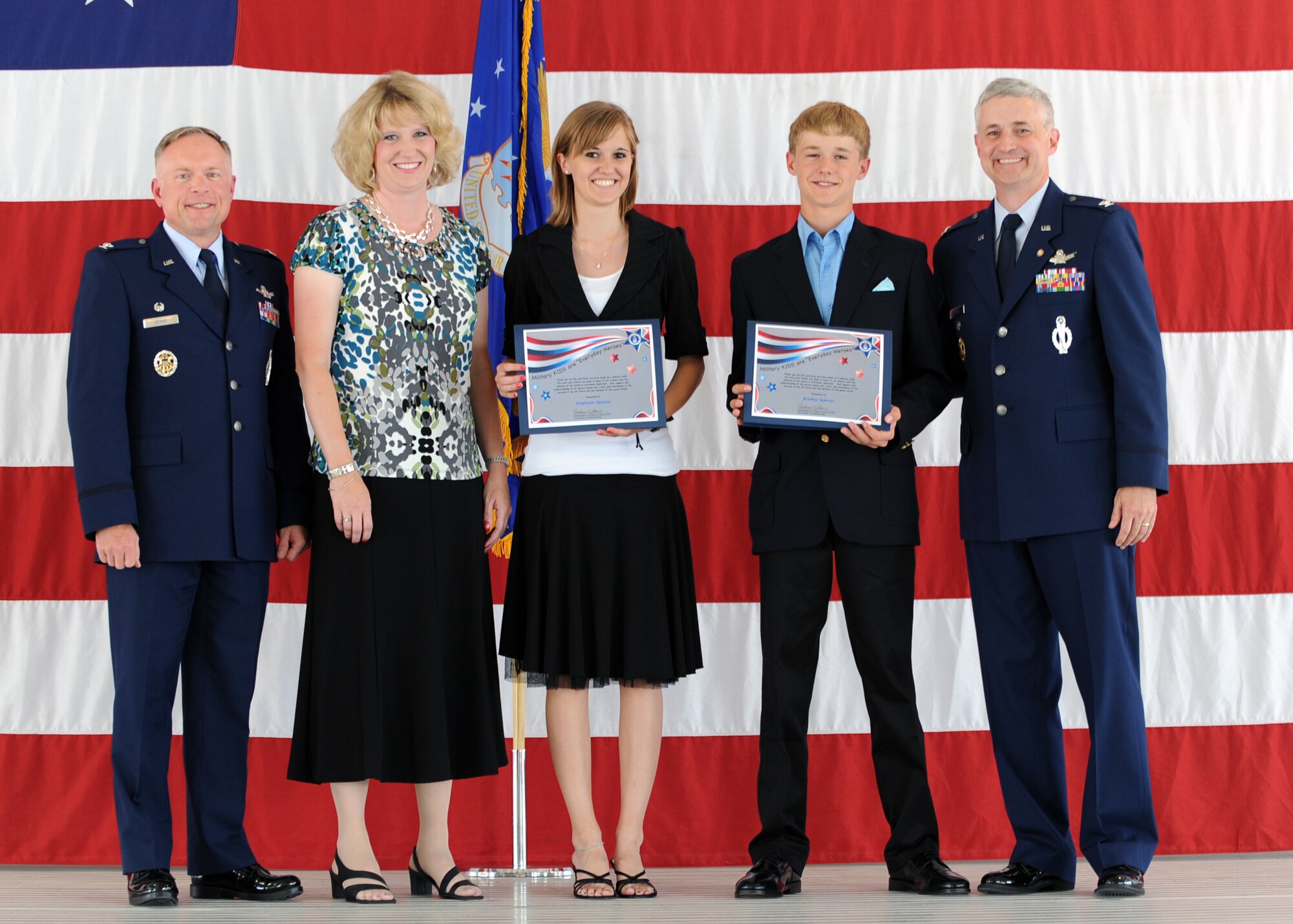 MINOT AIR FORCE BASE, N.D. -- Retired Col. Michael Spencer, former 91st Missile Wing vice commander, poses with his wife, Debbie, and two children, Stephanie and Bradley, along with Col. Ferdinand Stoss, 91st MW commander. Colonel Spencer served as the 91st MW’s vice commander since June 2008. He served in the Air Force for more than 23 years. (U.S. Air Force photo by Staff Sgt. Keith Ballard)