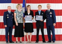 MINOT AIR FORCE BASE, N.D. -- Retired Col. Michael Spencer, former 91st Missile Wing vice commander, poses with his wife, Debbie, and two children, Stephanie and Bradley, along with Col. Ferdinand Stoss, 91st MW commander. Colonel Spencer served as the 91st MW’s vice commander since June 2008. He served in the Air Force for more than 23 years. (U.S. Air Force photo by Staff Sgt. Keith Ballard)