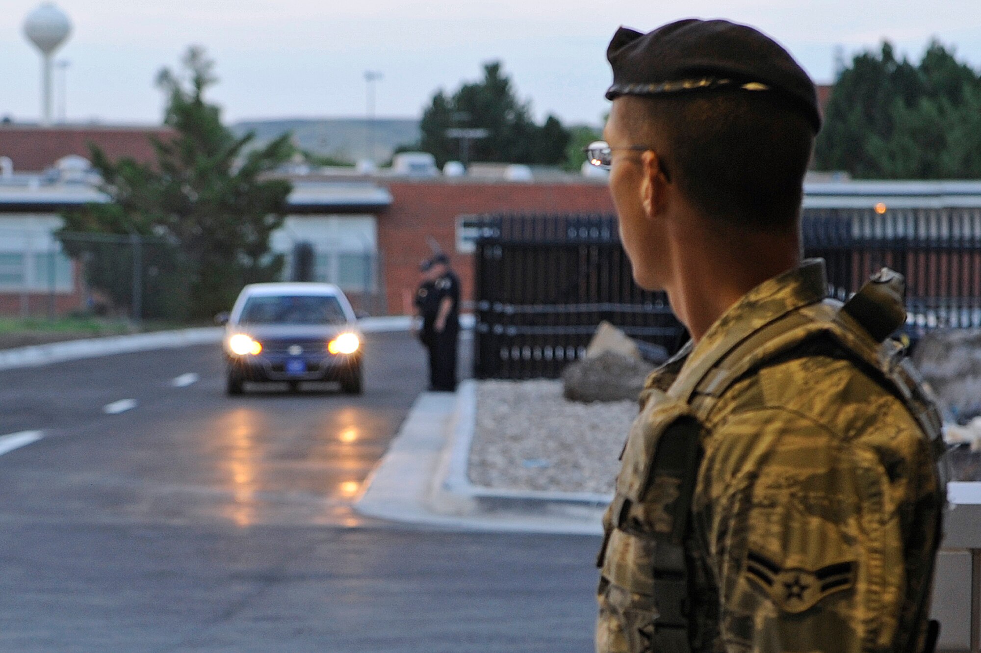 ELLSWORTH AIR FORCE BASE S.D.--  Airman 1st Class Justin Huckaby, 28th Security Forces Squadron Alpha Flight member,  stands ready at the Patriot gate, Aug. 2.  Col. Jeffrey Taliaferro, 28th Bomb Wing commander, was the first person to pass through the new Patriot gate when it re-opened Aug. 2. (U.S. Air Force photo/Staff Sgt. Marc I. Lane)