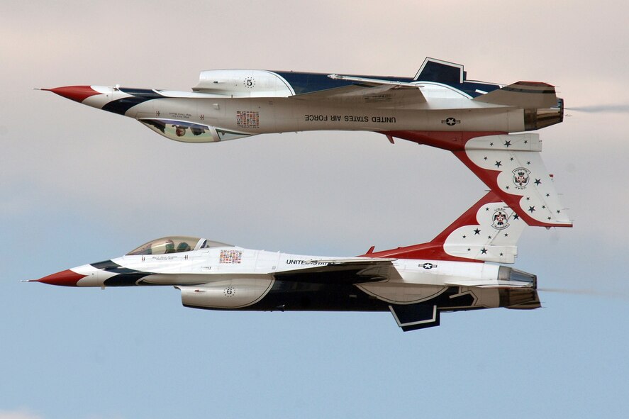 OFFUTT AIR FORCE BASE, Neb. - Two members of the U.S. Air Force Thunderbirds demonstration team perform a heart-stopping and gravity-defying maneuver at 2008's Air Force Week in the Heartland. The Thunderbirds will be here again Aug. 28 - 29 for the 2010 Defenders of Freedom Open House and Air Show on base. The event is free and open to the public. For more information about this and other performers, visit www.offuttairshow.com. The Thunderbird team is made up of more than 120 personnel who represent all Airmen across the globe. The primary Thunderbird mission is to represent the Pride, Precision and Professionalism all Airmen demonstrate. From the ground show to the breathtaking aerial maneuvers, the Thunderbirds continue to represent America's Airmen. U.S. Air Force photo by Josh Plueger