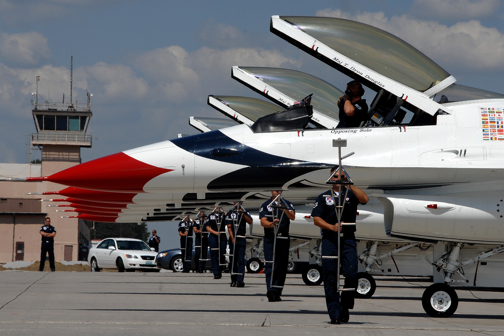 OFFUTT AIR FORCE BASE, Neb. - The U.S. Air Force Thunderbirds demonstration team prepare for the ground show protion of their appearance at 2008's Air Force Week in the Heartland. The Thunderbirds will be here again Aug. 28 - 29 for the 2010 Defenders of Freedom Open House and Air Show on base. The event is free and open to the public. For more information about this and other performers, visit www.offuttairshow.com. The Thunderbird team is made up of more than 120 personnel who represent all Airmen across the globe. The primary Thunderbird mission is to represent the Pride, Precision and Professionalism all Airmen demonstrate. From the ground show to the breathtaking aerial maneuvers, the Thunderbirds continue to represent America's Airmen. U.S. Air Force photo by Josh Plueger

