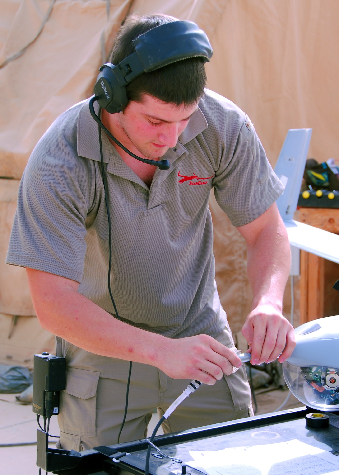 Elias Fowler, 332nd Security Forces Group field service representative, connects the pitot tube to calibrate the aircraft’s airspeed of an unmanned aerial vehicle used for daily Scan Eagle program operations July 29, 1010, Joint Base Balad, Iraq. The Scan Eagle is a remotely piloted aircraft that provides real-time situational awareness and force protection information for Air Force Security Forces Expeditionary Teams. Mr. Fowler is a native of Transverse City, Mich. (U.S. Air Force photo/Senior Airman Marianne E. Lane)