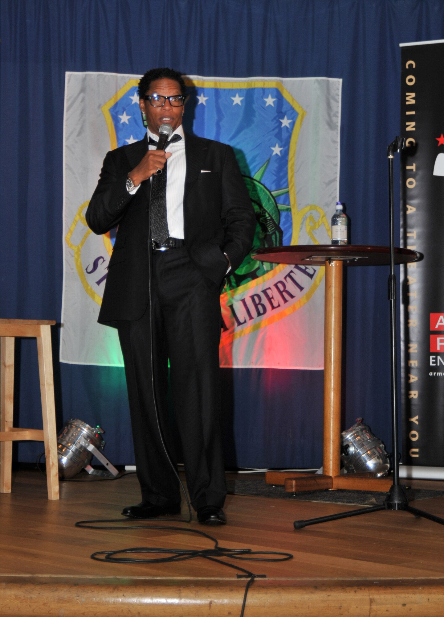 Comedian D.L. Hughley performs at the Liberty Club on Royal Air Force Lakenheath, England, August 3. Approximately 200 Airmen came to see and laugh at Mr. Hugley, a veteran of movies, television and stand-up comedy. (U.S. Air Force photo/Senior Airman David Dobrydney)
