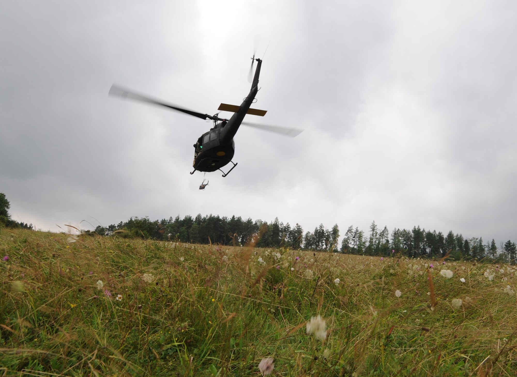 Huey's leave the landing zone after an air assault mission scenario during exercise ALLIED STRIKE 10, Hohenfels, Germany, Aug. 3, 2010. AS 10 is Europe's premier close air support (CAS) exercise, held annually to conduct robust, realistic CAS training that helps build partnership capacity among allied North Atlantic Treaty Organization nations and joint services while refining the latest operational CAS tactics. For more ALLIED STRIKE information go to www.usafe.af.mil/alliedstrike.asp. (U.S. Air Force photo by Senior Airman Caleb Pierce)