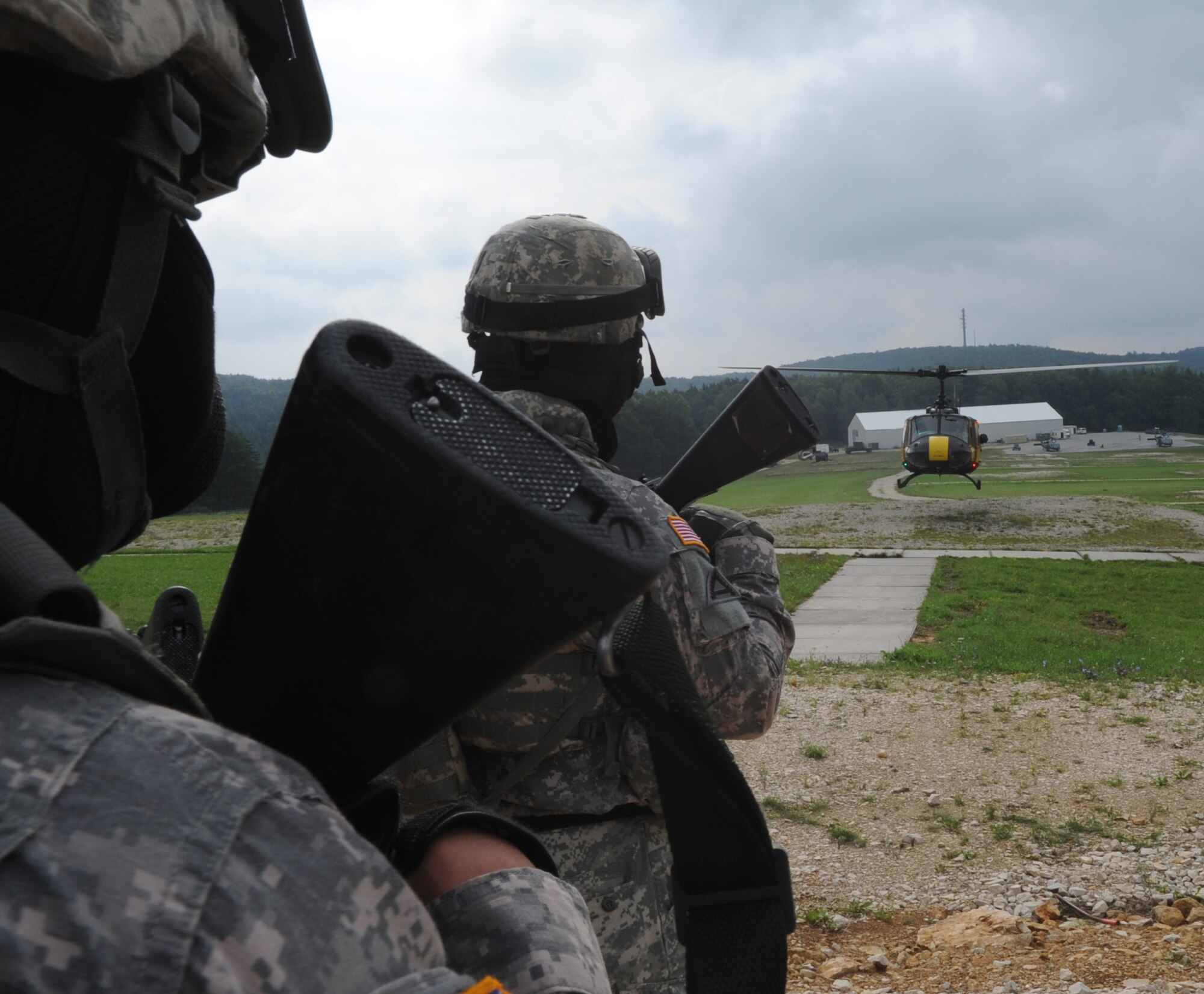 A U.S. Army squad waits to load in a Huey for an air assault mission scenario during exercise ALLIED STRIKE 10, Hohenfels, Germany, Aug. 3, 2010. AS 10 is Europe's premier close air support (CAS) exercise, held annually to conduct robust, realistic CAS training that helps build partnership capacity among allied North Atlantic Treaty Organization nations and joint services while refining the latest operational CAS tactics. For more ALLIED STRIKE information go to www.usafe.af.mil/alliedstrike.asp. (U.S. Air Force photo by Senior Airman Caleb Pierce)