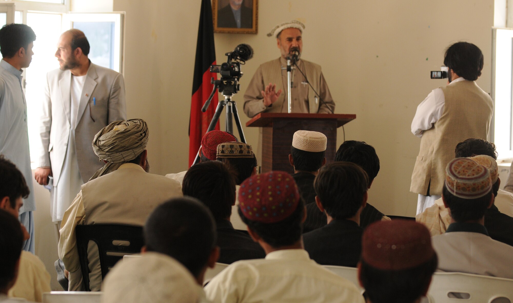 QALAT CITY, Afghanistan -- Zabul Provincial Governor Ashraf Naseri speaks to a group of volleyball coaches during a sports meeting in Qalat City, Zabul Province, Aug. 1, 2010. The equipment was donated by the Zabul Provincial Governor and Provincial Reconstruction Team Zabul. The volleyball coaches received new volleyballs, shoes, uniforms and nets for the upcoming season. (U.S. Air Force photo/Senior Airman Nathanael Callon)