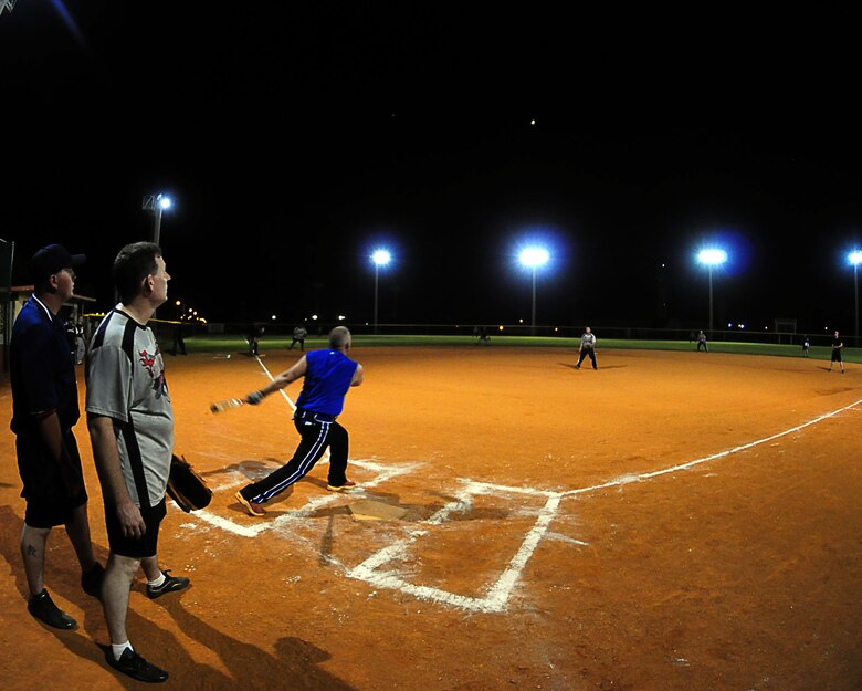 ANDERSEN AIR FORCE BASE, Guam - A member of the 36th Security Forces Squadron's intramural softball team hits a fly-ball during the base intramural softball championship between the 36th SFS and 36th Logistical Readiness Squadron here Aug 2. The game was an offensive shoot-out with several homeruns and runs scored. The final tally was 19-16 with the 36th SFS team walking away the victors. (U.S Air Force photo by Airman Julian North) 