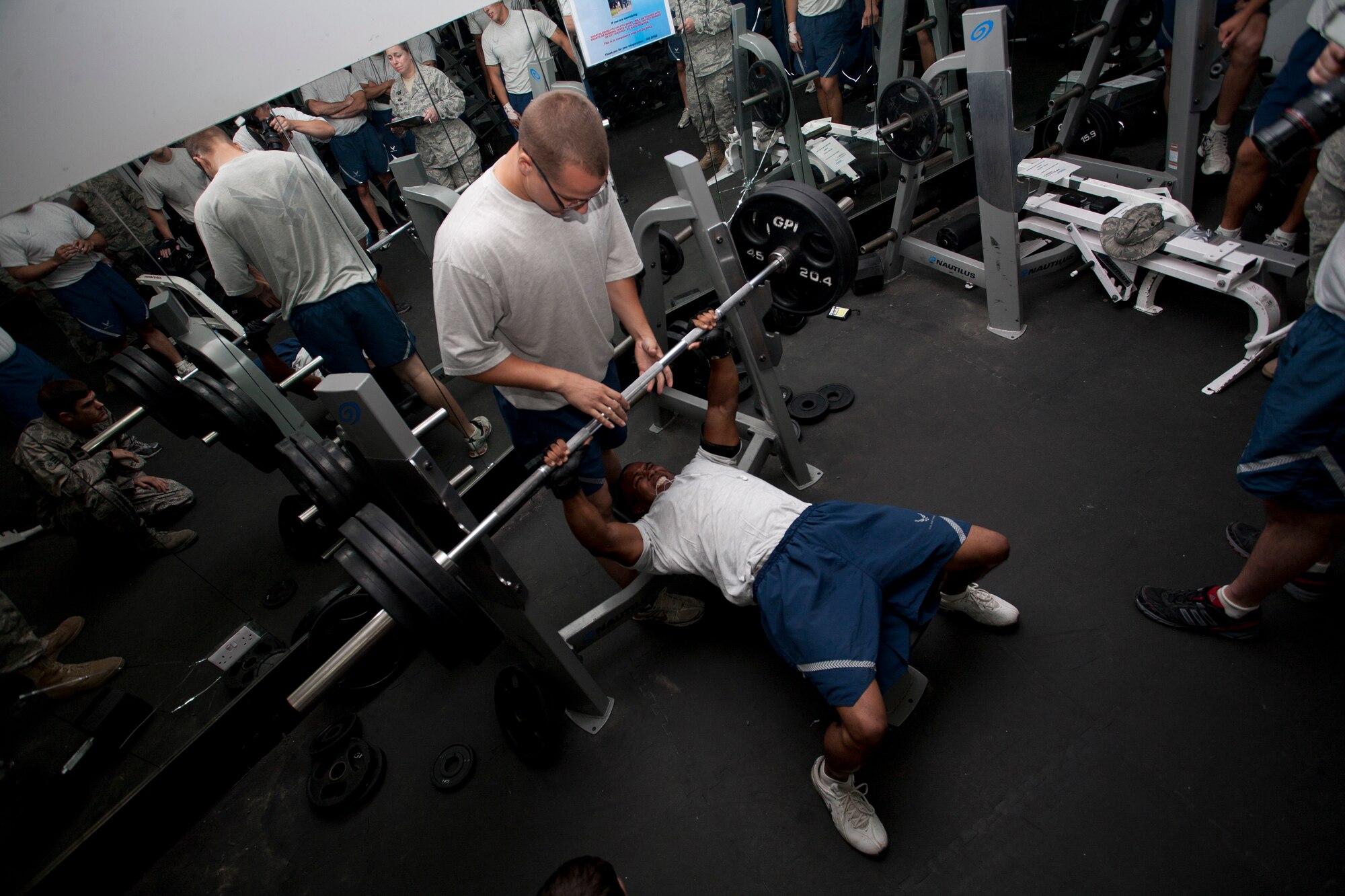 Staff Sgt. Marcus Goodloe, Expeditionary Civil Engineer Squadron, competes in a bench press competition July 31 at an undisclosed location in Southwest Asia. Nine Airmen competed in the competition, Airman 1st Class Joshua Carabajal, 380th Expeditionary Security Forces Squadron, won first place and Senior Master Sgt. Samuel Freeman, 380th Logistics Readiness Squadron took second place. (U.S. Air Force Photo/Tech Sgt. Sean Blumenhien) 