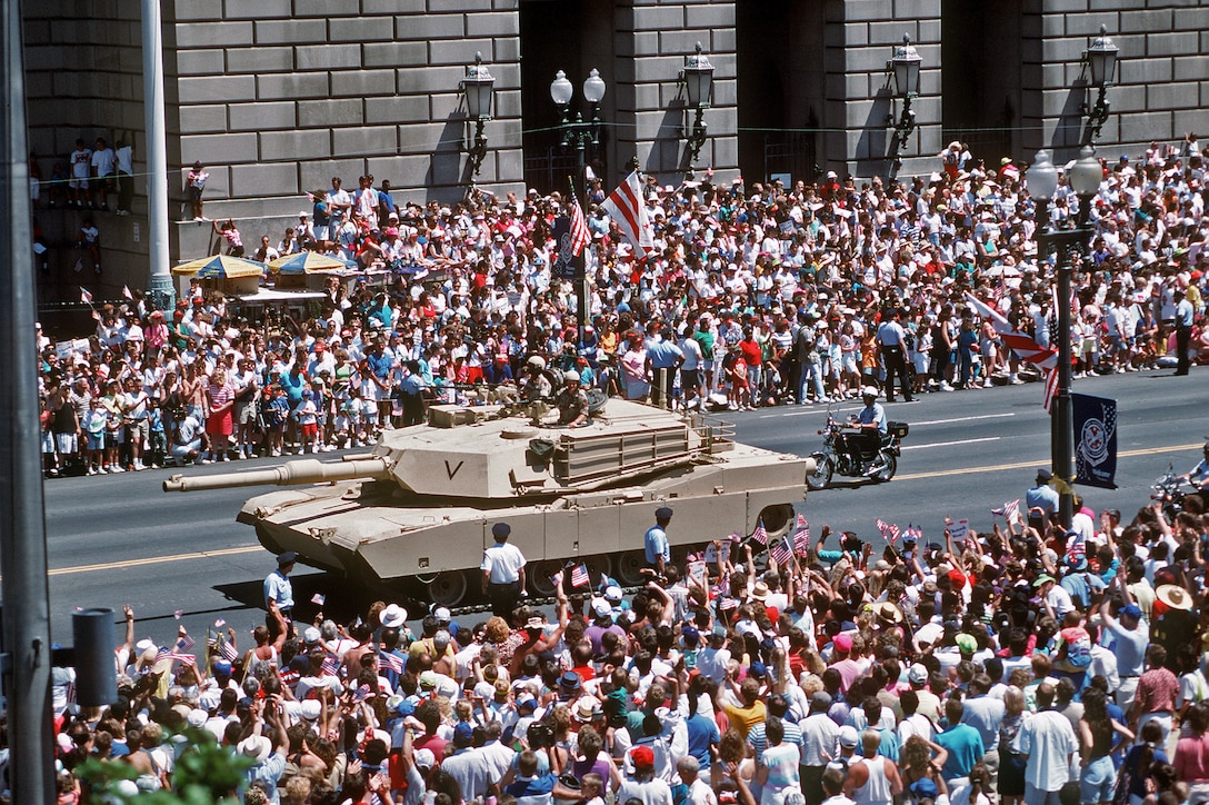 U.S. Army soldiers drive an M-1A1 Abrams tank in the National Victory Celebration parade honoring the coalition forces of Desert Storm.