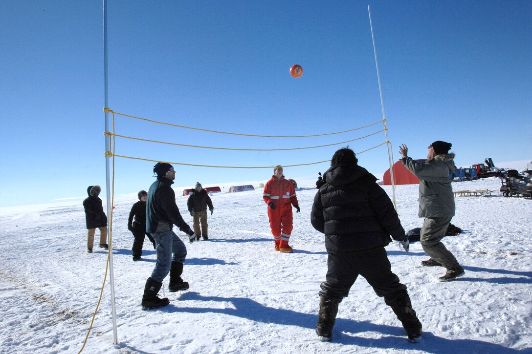 Taking advantage of Greenland summer temperatures in the high teens, scientists and others gather for a quick game of volleyball, July 28, 2010. U.S. Air Force Lt. Col. Robert Bullock, assigned to the New York Air National Guard, joins in.