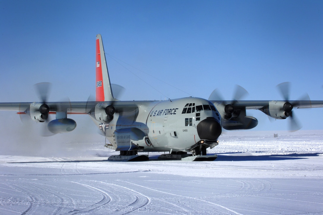 A ski-quipped LC-130 Hercules lands at a remote science research ...