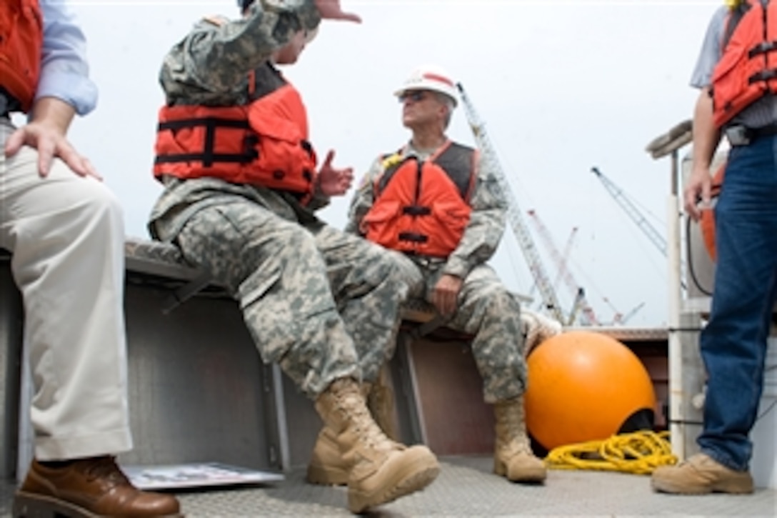 Chief of Staff of the Army Gen. George W. Casey Jr. is given a tour of the Surge Barrier Wall that is being constructed by the Army Corps of Engineers in New Orleans, La., on Aug. 3, 2010.  The Corps' mission is to provide vital public engineering services in peace and war to strengthen our nation's security, energize the economy and reduce risks from disasters.  