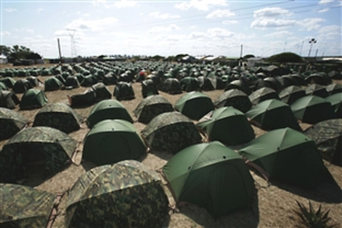 Two acres of tents serve as temporary quarters for the joint task force participating in Exercise Shared Accord 2010, Moamba, Mozambique, July 31, 2010. During the exercise, which began Aug. 3, 2010, U.S. troops are working alongside Mozambique soldiers in an exchange of information.