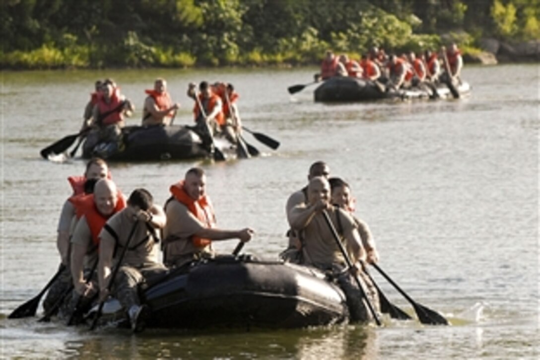 U.S. Army soldiers paddle their zodiac watercraft three-and-a-half miles during a physical training challenge lead by the brigade's Command Sgt. Maj. James Pippin on Cow House Creek, Fort Hood, Texas, July 30, 2010. The soldiers are assigned to the 1st Cavalry Division's 3rd Brigade Combat Team.