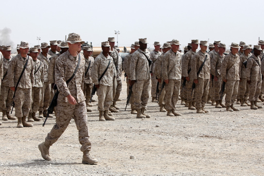 Lance Cpl. Trevor D. McNally, water support technician for 9th Engineer Support Battalion, 1st Marine Logistics Group (Forward), marches out to be awarded the Navy and Marine Corps Achievement Medal at Camp Leatherneck, Afghanistan, Aug. 4. McNally, 20, from Hinckley, Minn., received the award for ‘superior performance of his duties’ in support of International Security Assistance Force operations. As a lance corporal, he completed 37 Marine Corps Institute courses and earned a perfect 300 on the Physical Fitness Test and a 297 on the Combat Fitness Test.