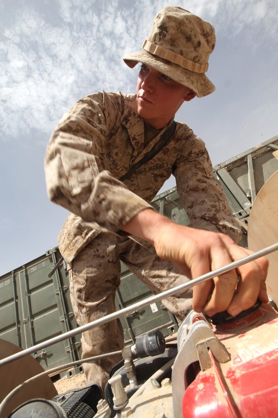 Lance Cpl. Trevor D. McNally, water support technician for 9th Engineer Support Battalion, 1st Marine Logistics Group (Forward), tests out a water pump at Camp Leatherneck, Afghanistan, Aug. 4. McNally, 20, from Hinckley, Minn., was awarded the Navy and Marine Corps Achievement Medal for his ‘superior performance’ in support of International Security Assistance Force operations.